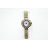 A ladies gold wristwatch with diamond set bezel (totalling approx 0.