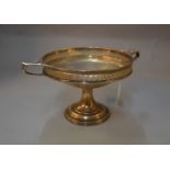 A silver two-handled cake stand with pedestal stand & pierced decoration,