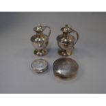 POLICE > A two-bottle silver religious cruet, H/M Sheffield 1971, together with two silver Pyx,
