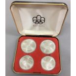 A cased set of 4 commemorative Olympic coins Montreal 1976 [NO RESERVE]