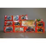 12 x Britains 1:32 scale diecast model agricultural vehicles and implements. Boxed.