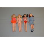 Four Mattel Barbie dolls: three Skooter, one blonde, one brunette, one titian; Twist n Turn Skipper.