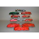 Twelve unboxed tinplate and plastic cars includes examples by Tri-ang and Bandai.