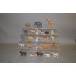 A quantity of unboxed plastic animal figures and fencing by Britains and others.