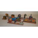 Five vintage tinplate mechanical models mounted on wooden plinths, mostly by Hess.