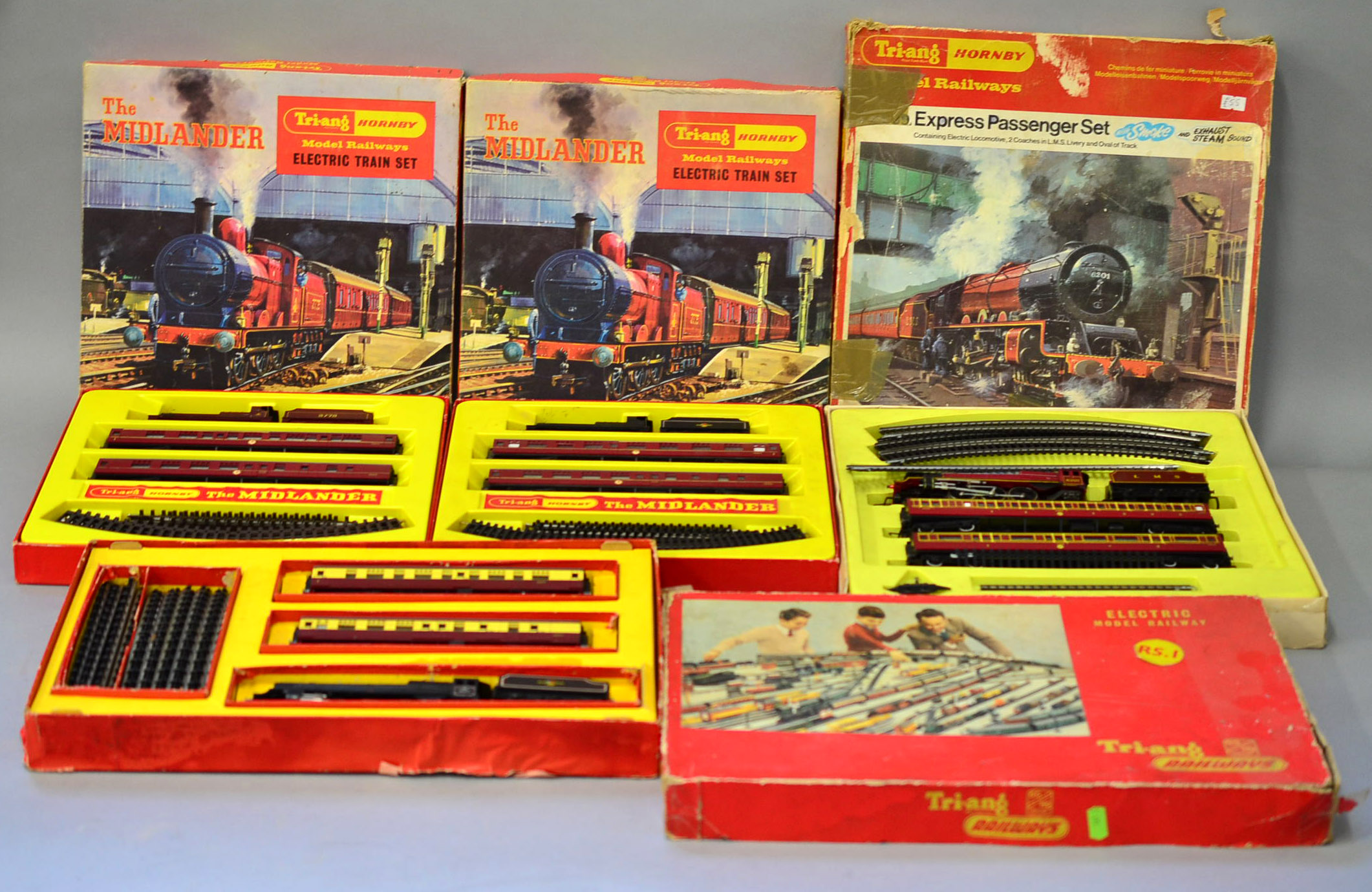 O gauge. Four Triang Hornby train sets: RS1; two RS8; RS609. In P-F boxes.