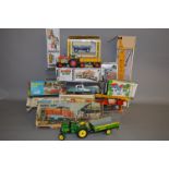 A number of boxed tinplate toys, mostly farm/construction related by Kovap.