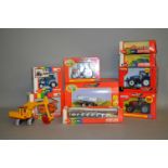 Nine boxed Britains 1:32 scale diecast agricultural models and implements,