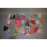 Very good quantity of Mattel Barbie clothing, includes: Barbie in Hawaii; Airline Outfit; etc.