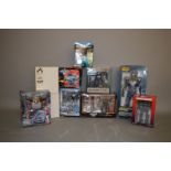 10 x assorted action figures, including Kenner Robocop, Palisades Muppets, etc. All boxed.