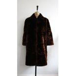 Vintage 1940s quality chocolate brown beaver lamb ladies coat. Size 10-12. Very good condition.