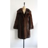 Vintage 1950s ladies mink coat. Edge to edge style, 3/4 length with s shawl collar.