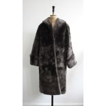Vintage 1950s luxurious grey beaver lamb fur coat by 'De Bella'. Size approx 10-12.