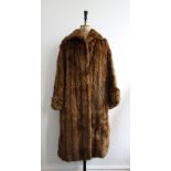 Vintage 1950s musquash ladies fur coat. Flared sleeves and swing style.