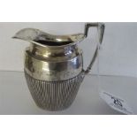 A hallmarked silver cream jug