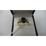 A diamond and sapphire 3 stone ring set in 18ct yellow gold