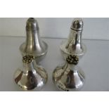 A pair of Stuart Devlin hallmarked silver salt and pepper pots,1976 and one other pair