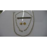 2 x 9 ct gold charms ( 2.53g), 2 silver chains (33.12g) and one other bracelet