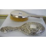 A hallmarked silver dressing table mirror and a brush