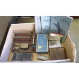 A Morse code key and 3 booklets of pilots notes along with cigarette cases, tins etc