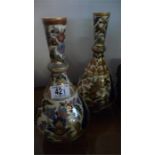 A near pair of Zsolnay baluster vases decorated with exotic birds, 28 & 29 cm approx- very slight