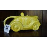 A yellow Sadlers tea pot in the form of a racing car