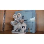 Lladro figure group 5353 of children riding a polar bear