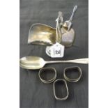 A hallmarked silver dessert spoon, 3 silver napkin rings and a silver plated helmet shaped sugar