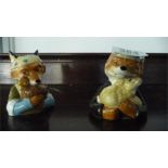 A Beswick salt and pepper depicting Mr & Mrs Fox holding a chicken and a rabbit