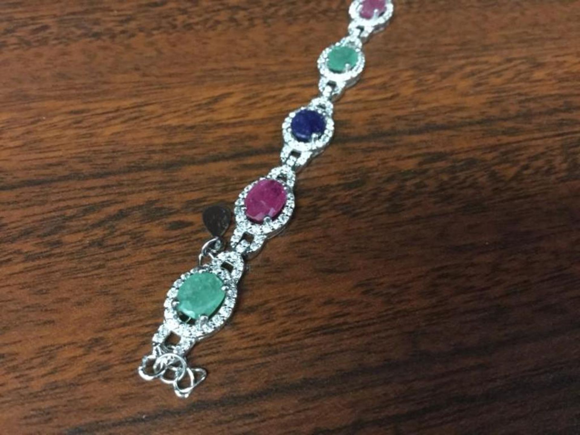 Sterling Silver bracelet with Rubies, emeralds, and sapphires value $700