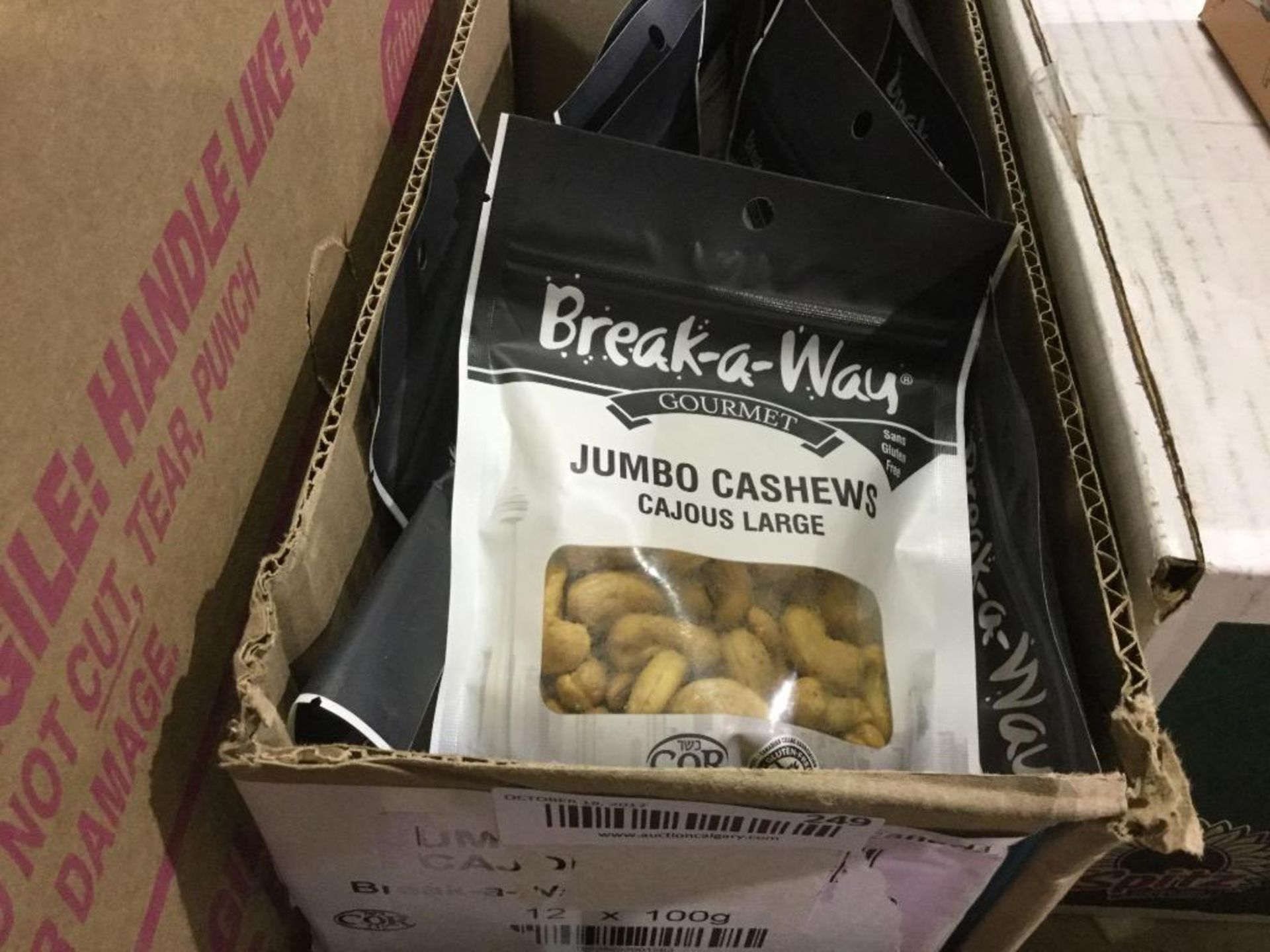 Open Box of Break-a-way Jumbo Cashews 100g bags appox 12