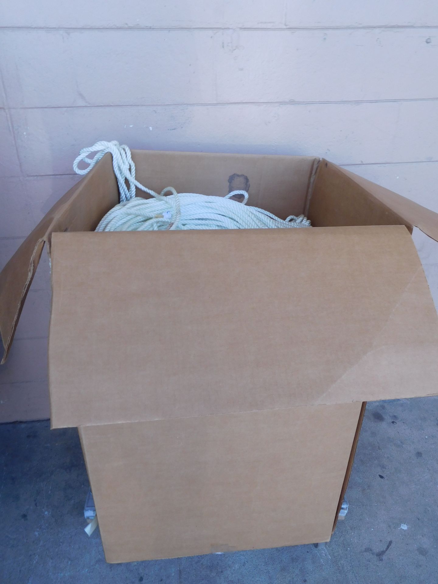 6900 FEET OF MILITARY 3/8 BRAIDED NYLON ROPE; BULK SPOOLED IN LARGE BOX ON PALLET