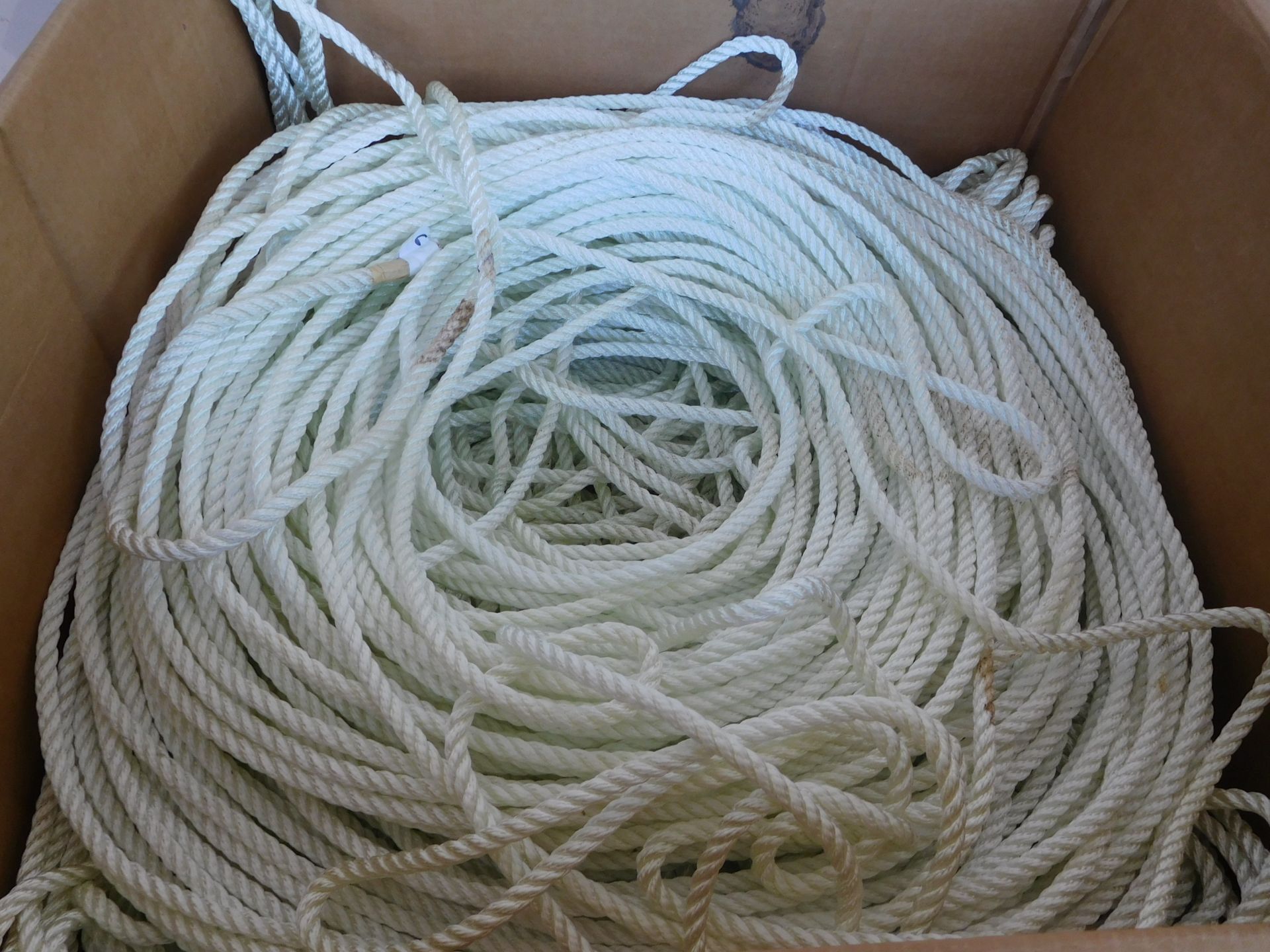 6900 FEET OF MILITARY 3/8 BRAIDED NYLON ROPE; BULK SPOOLED IN LARGE BOX ON PALLET - Image 2 of 3