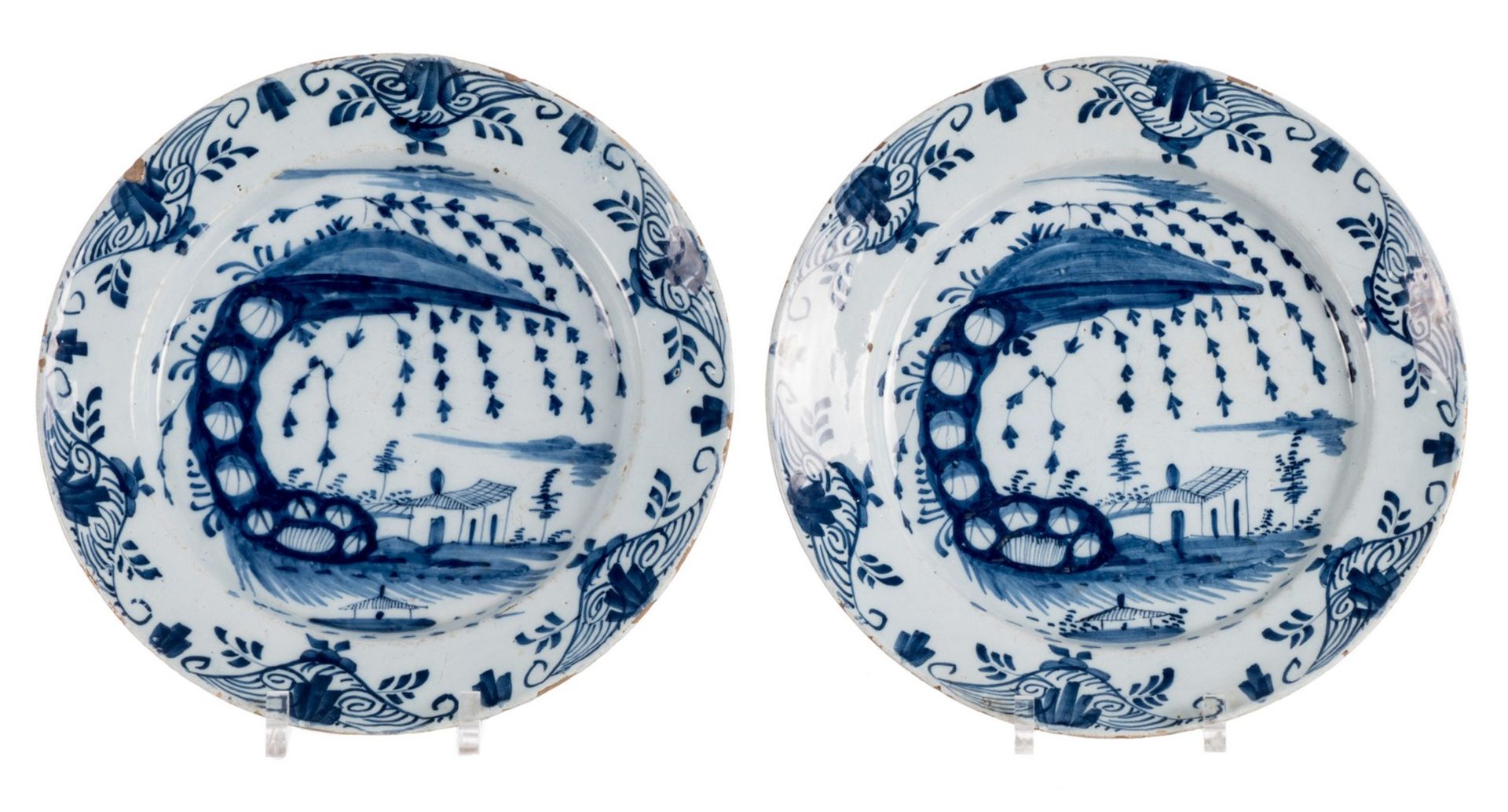 A pair of 18thC tin glazed and bleu decorated Dutch Delftware plates, (the usual glaze flaking to