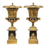 A pair of Neoclassical ornamental Medici type vases, gilt bronze and black enameled iron, H 67 cm