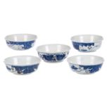 Five Chinese copper red and cobalt blue bowls, decorated with flowers and animals, marked Kangxi,