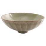 A Chinese Song celadon ground bowl with foliage relief decoration, H 7 - Diameter 17 cm (chip to the