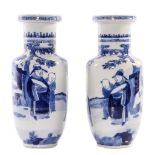 A pair of Chinese blue and white rouleau shaped vases, decorated with an animated scene, marked,