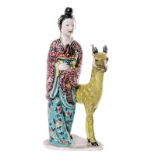 A Chinese polychrome porcelain figure of the immortal Magu with a deer, H 24 cm