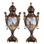 A pair of ornamental vases in Sèvres porcelain with gold-layered blue royale ground colour,