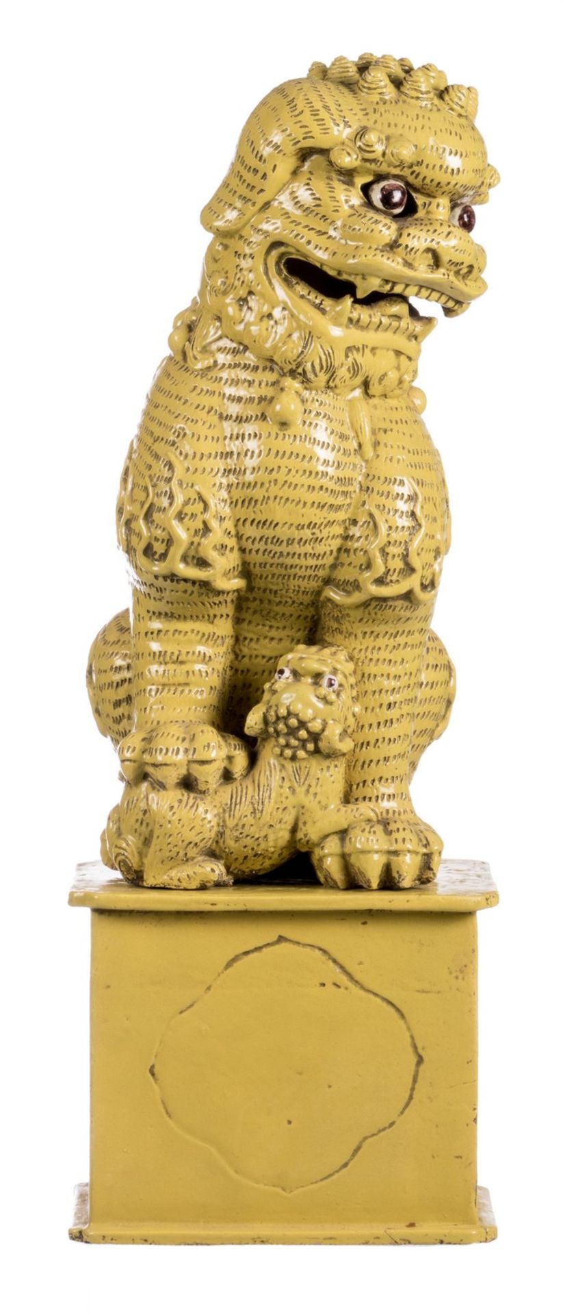Two Chinese yellow glazed terracotta Fû-lions on a ditto base, H with base 92,5 cm, without base
