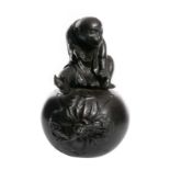 A Japanse bronze mellon shaped pot and cover, the knob modelled as a monkey, H 32 cm