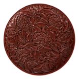 A red cinnabar lacquer plate, carved with chrysanthemum and scrolling foliage, with calligraphic