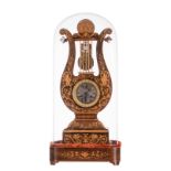 A French 19thC lyre-shaped marquetry veneered mantel clock, Charles X, with matching globe and base,