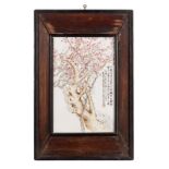 A Chinese famille rose plaque, decorated with cherry blossoms and calligraphic texts, signed, in a
