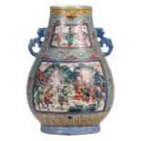 A Chinese turquoise ground famille rose vase, the roundels decorated with court scenes and warriors,