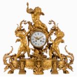 A late 19thC gilt bronze neoclassical mantel clock, the movement carried by three cupids, the dial