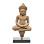 A Khmer temple guard in the Ankhor manor, sandstone, 13thC, mounted on a base, H 45 cm without