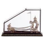 An Orient silver miniature carriage pulled by three horses and inside two Oriental ladies, in
