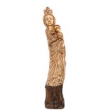 Our Lady with child and lamb, patinated ivory on a Gothic revival base, probably workshop Heckman